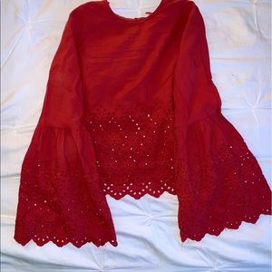 Bell sleeve Burt orange women’s top.